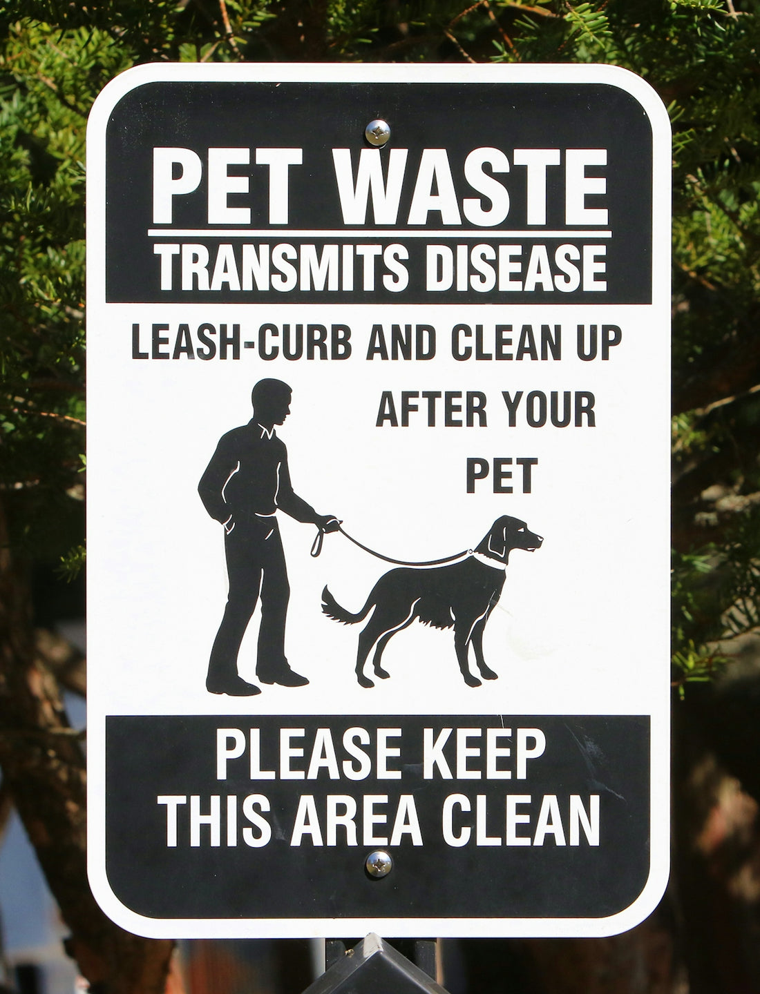 a black and white sign with a dog on it